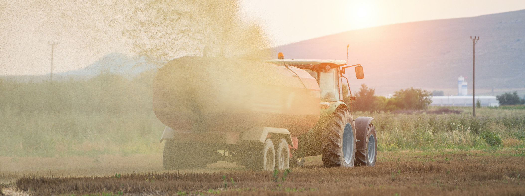 Tractor spraying fertilizer