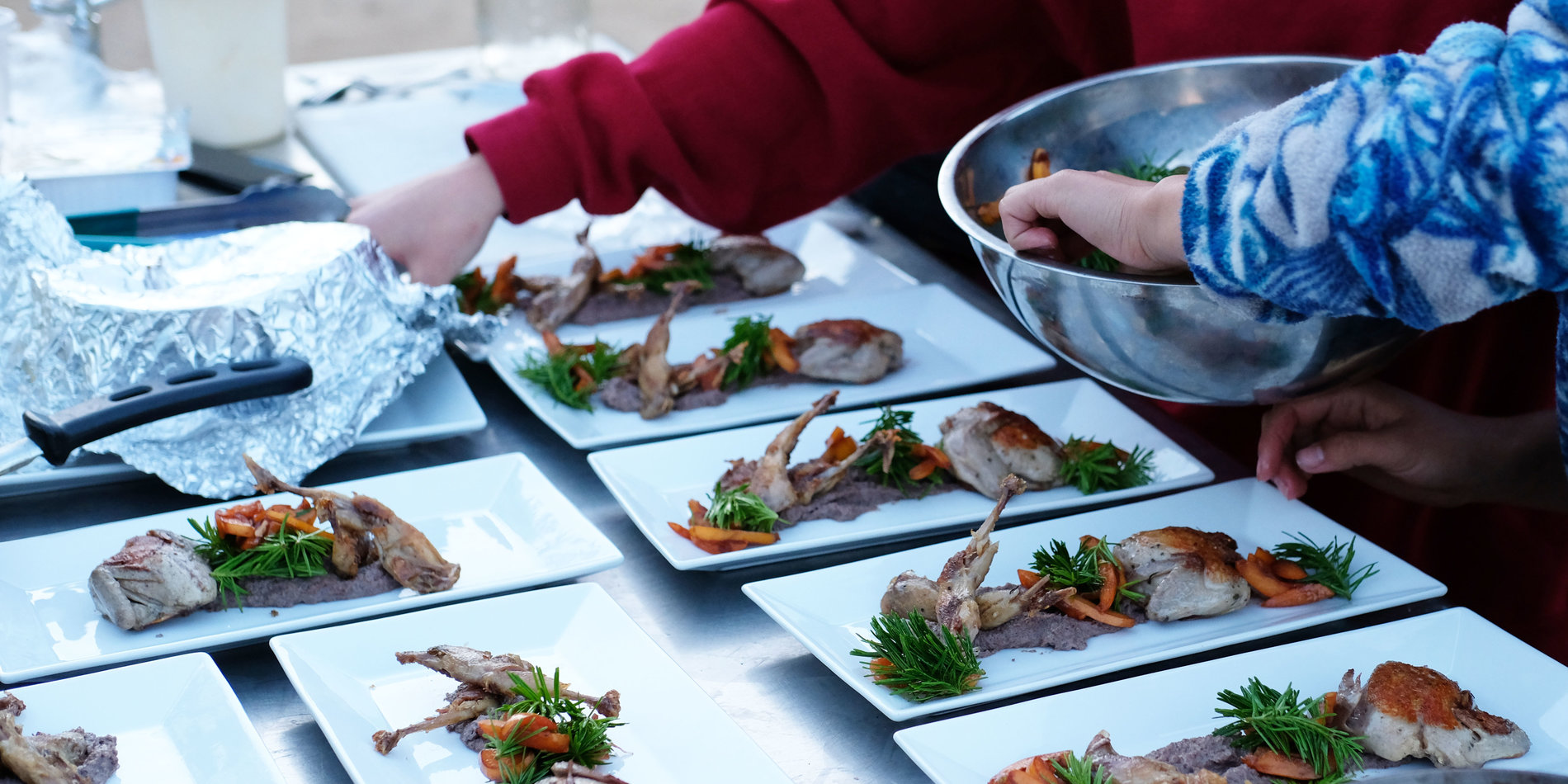 Students plating food.