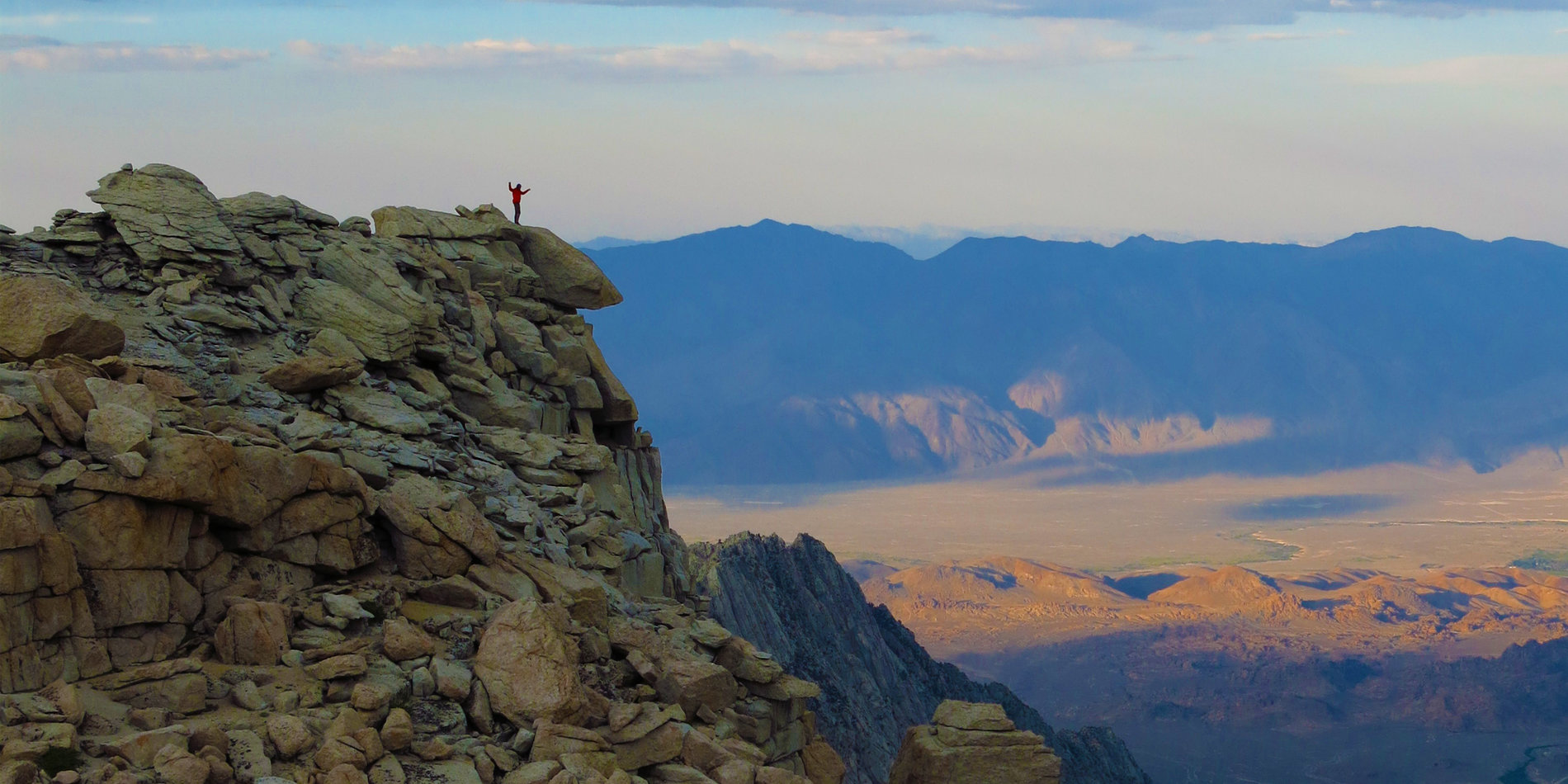Photo of student with mountain landscape.