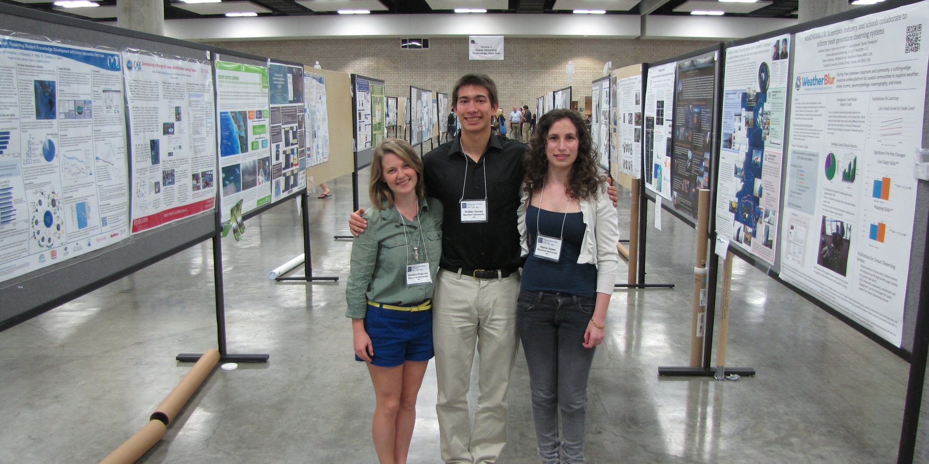 Students in front of posters