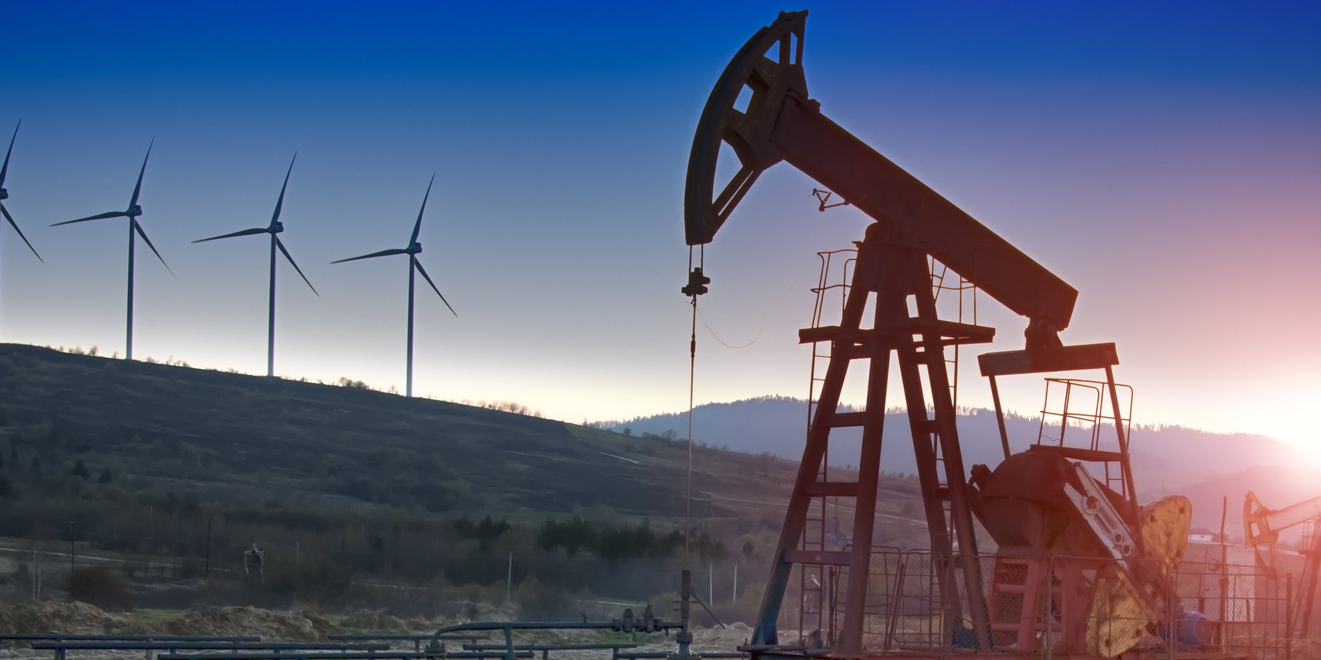 Oil derrick and wind turbines
