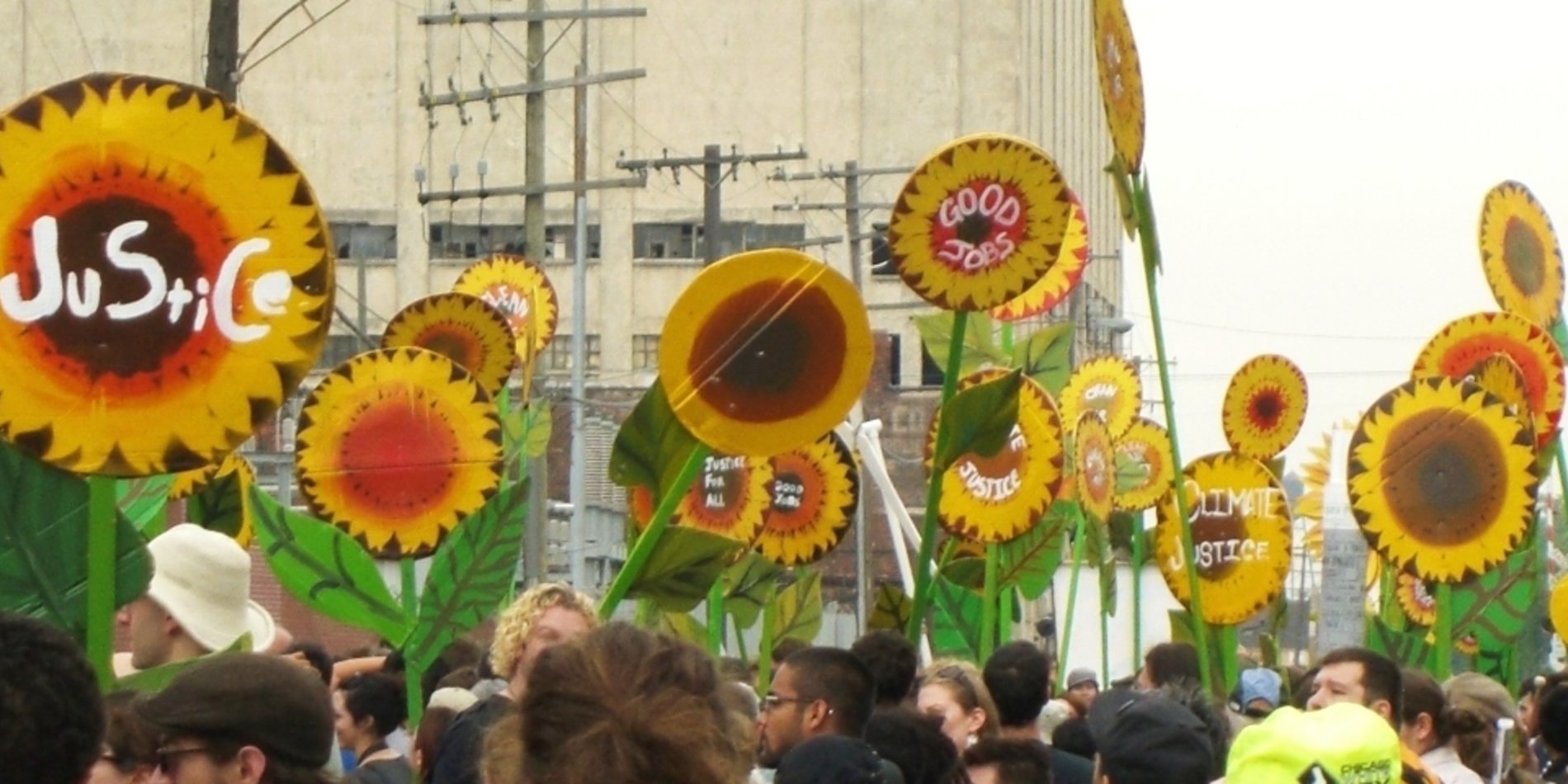 Signs being displayed during an environmental justice march.