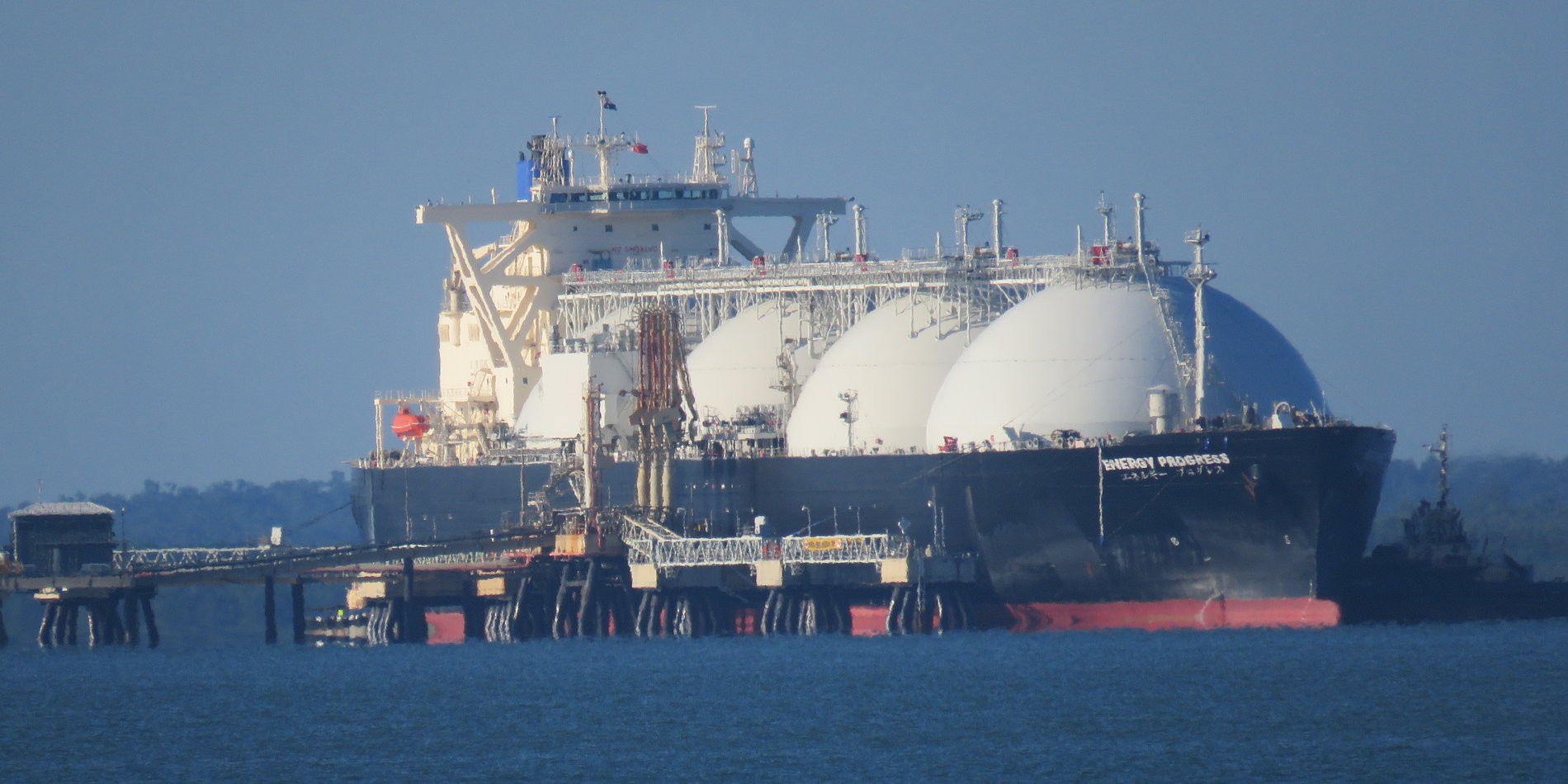 A liquified natural gas tanker at dock.