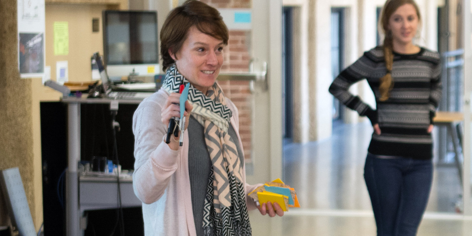 Kate Maher holding post-it notes