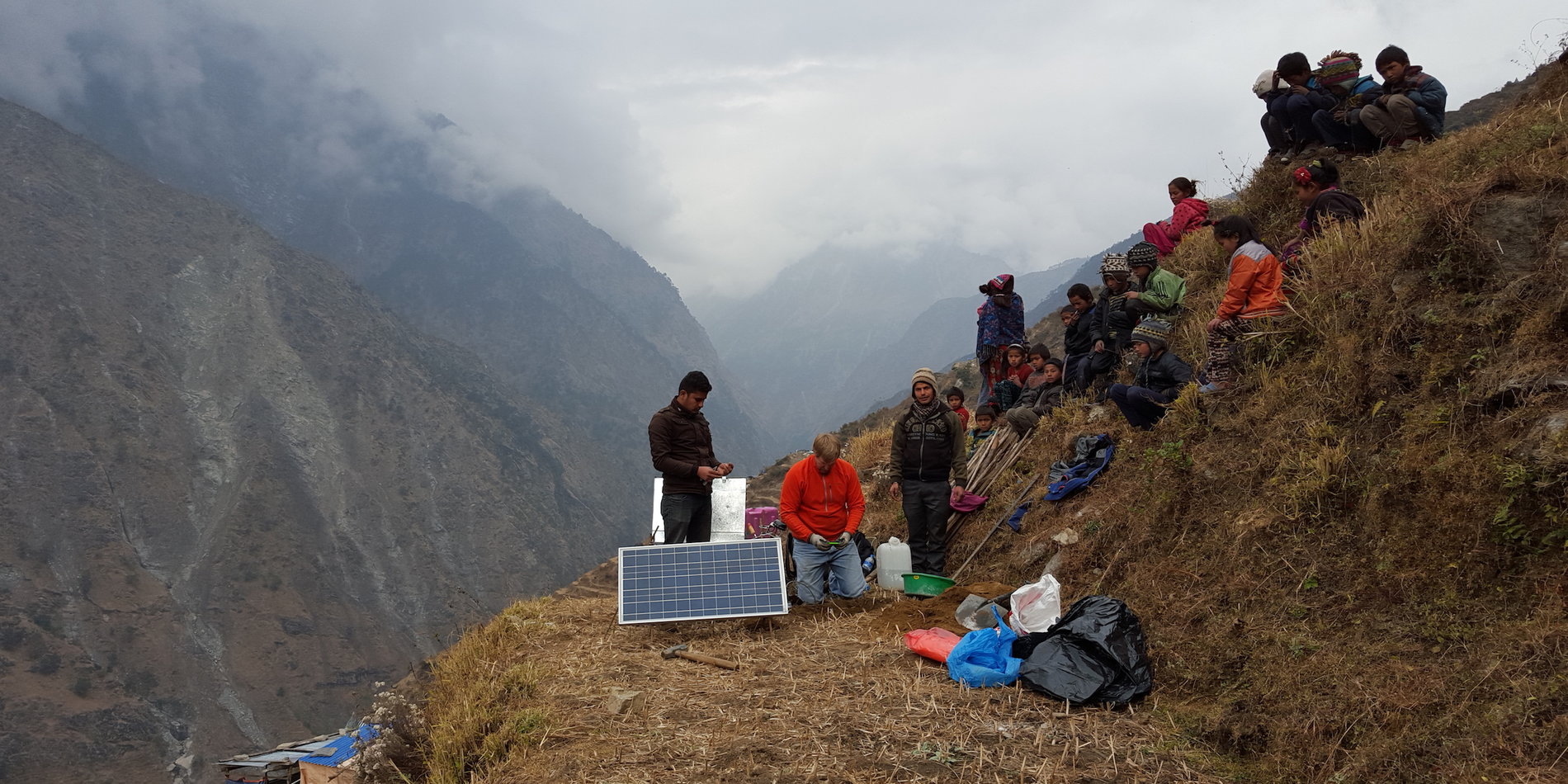 Group sitting on a hillside