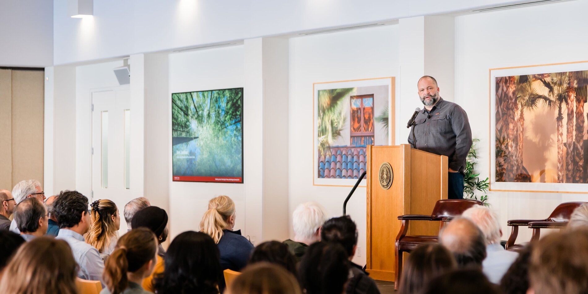 Wide view of Ben Jealous speaking at the podium in front of an audience