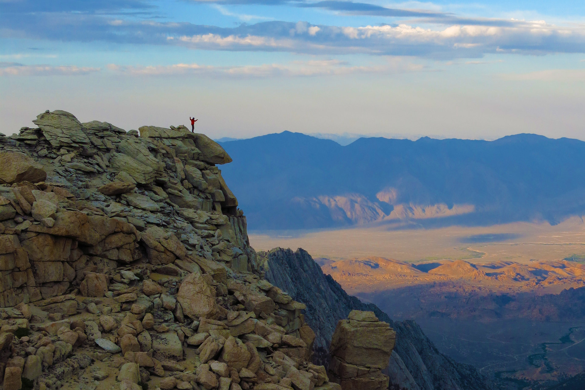 Photo of student with mountain landscape.