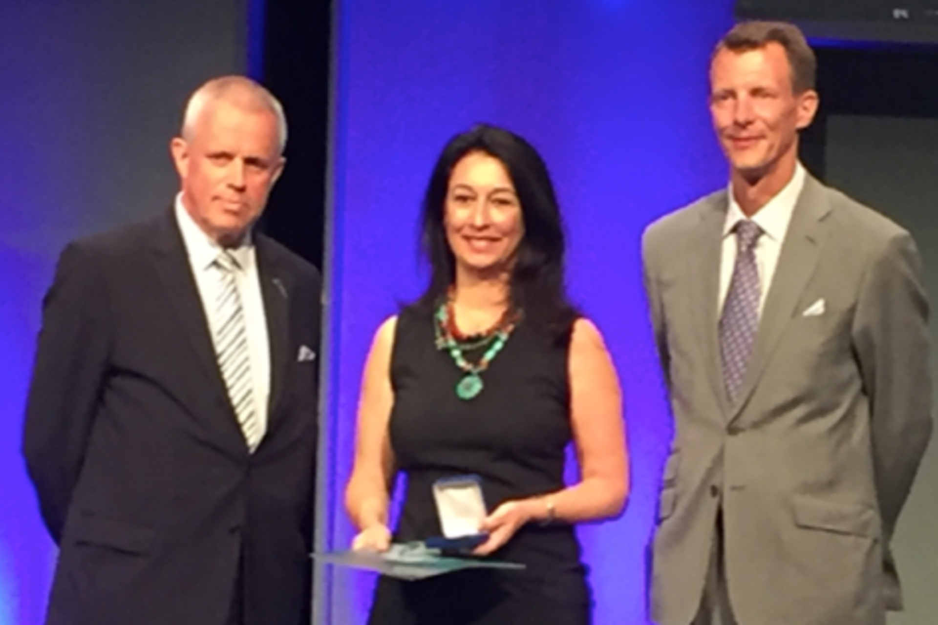 Vanorio receiving award.