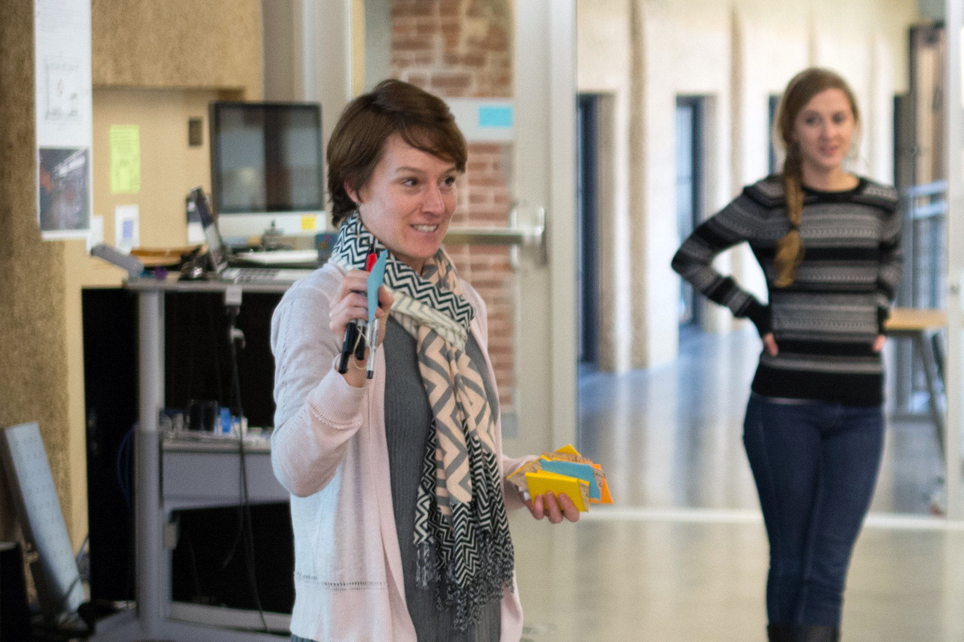 Kate Maher holding post-it notes