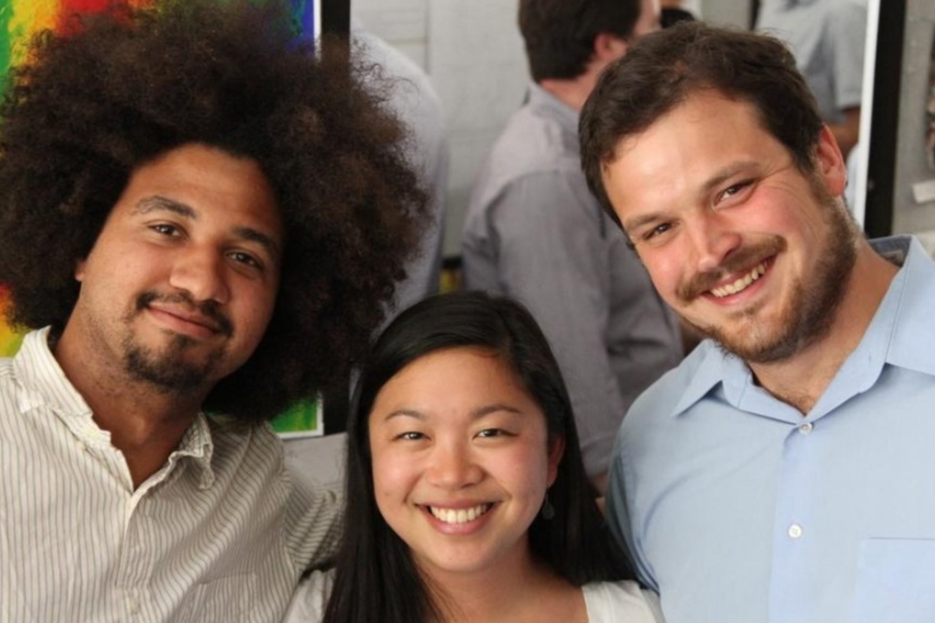 Three students smiling together