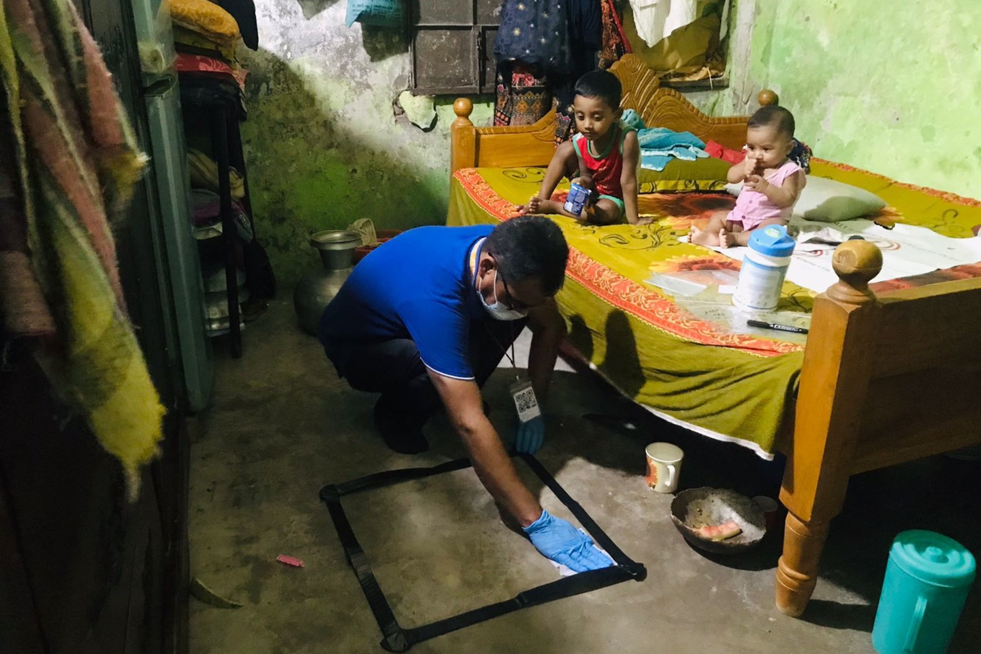 A researcher collects dust in a home in Mymensingh, Bangladesh, for lead analysis. | Musa Baker