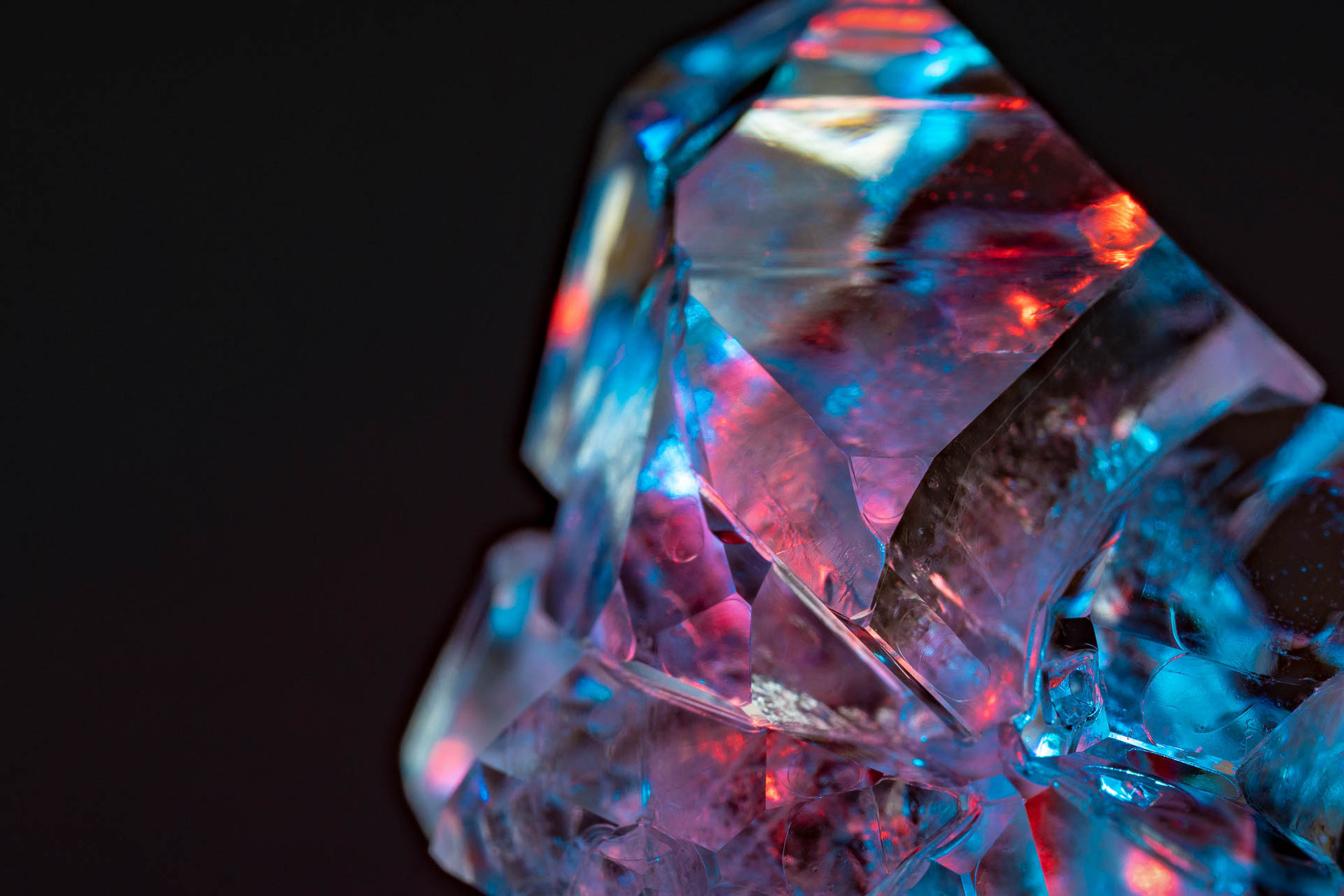 Clear rough cut diamond with blues and pinks