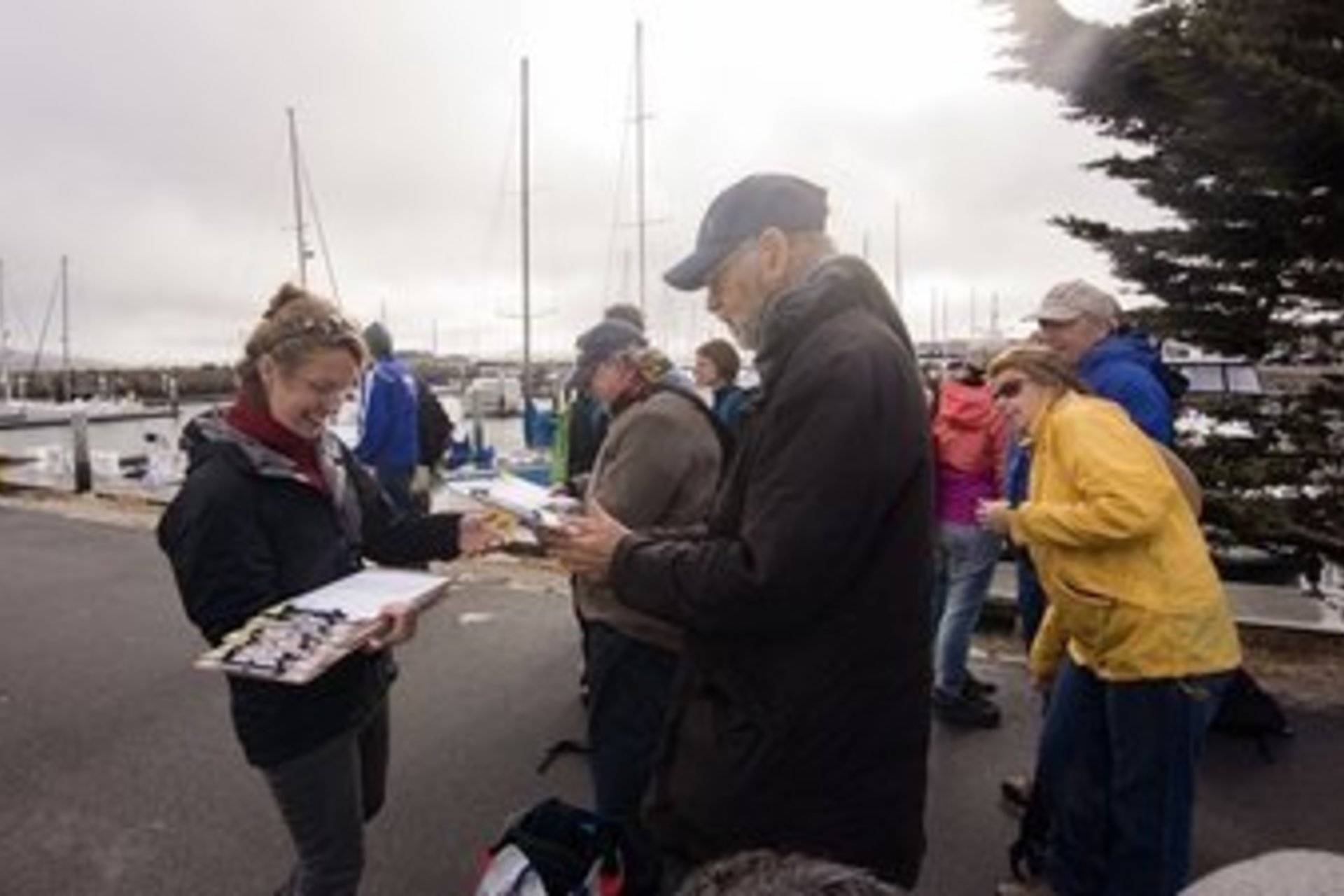 Nicole Ardoin distributing surveys to tourists