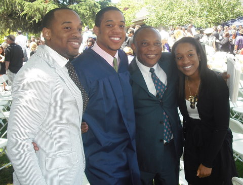 Usua and his family at high school graduation.
