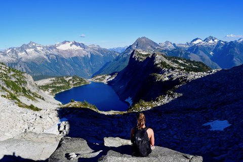 Student overlooking landscape with water.
