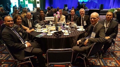 Edgar-Rangel German sits at table with colleagues