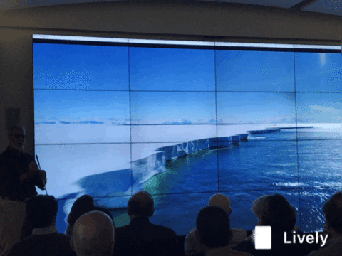 Students viewing glaciers on screen.