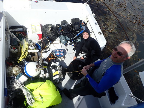 Researchers in boat with sensors