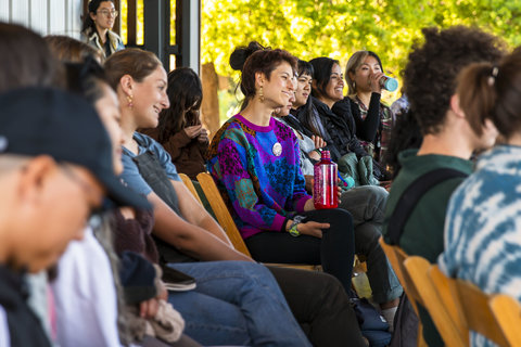 Students listen to the panel of artists.
