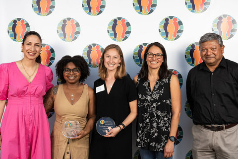 School leaders and Excellence in DEI award winners smiling together at the community celebration