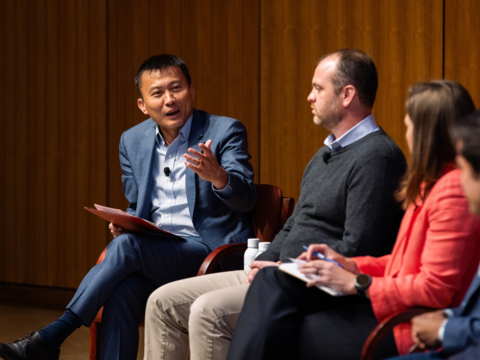 Yi Cui speaks to a panel on stage