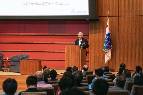 Yancey Hai speaks on stage