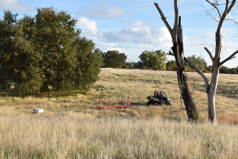 Researchers towing geophysical tracking devices across a field (Image credit Rosemary Knight)