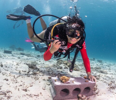 Pleng Kruesopon smiles during a coral restoration dive