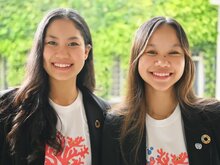 Pleng smiling next to her sister Pyn