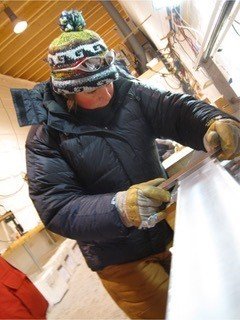 Julia Rosen working on ice cores in Greenland. Photo courtesy of Julia Rosen