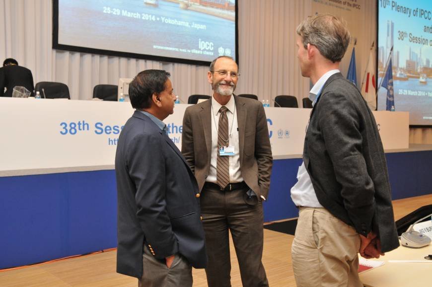 Chris Field talking to colleagues.